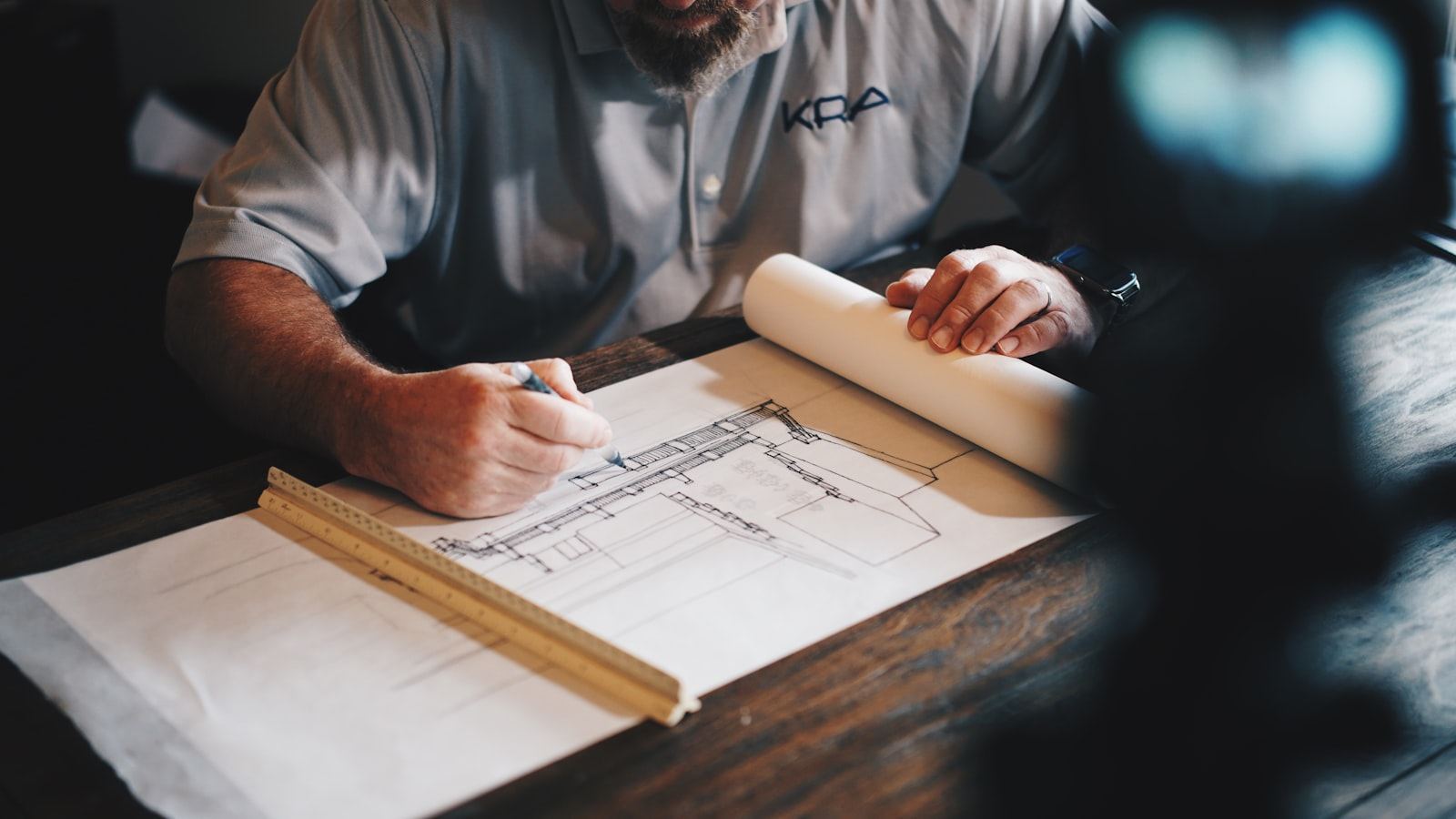 Contract manager working through survey drawings